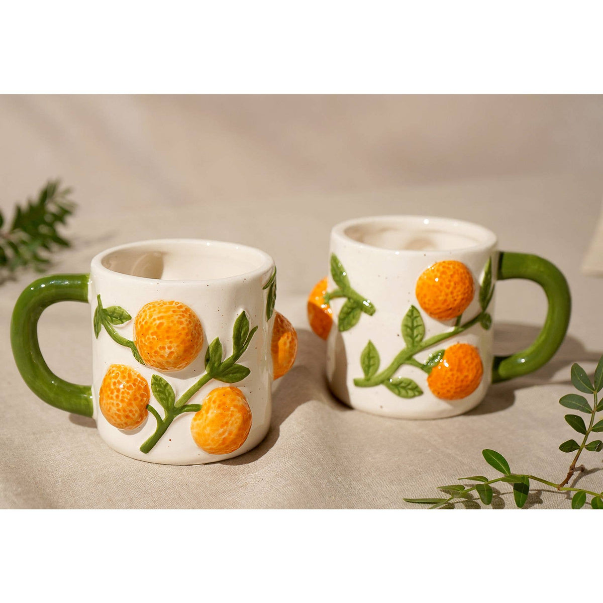 Hestia-Becher mit Orangen